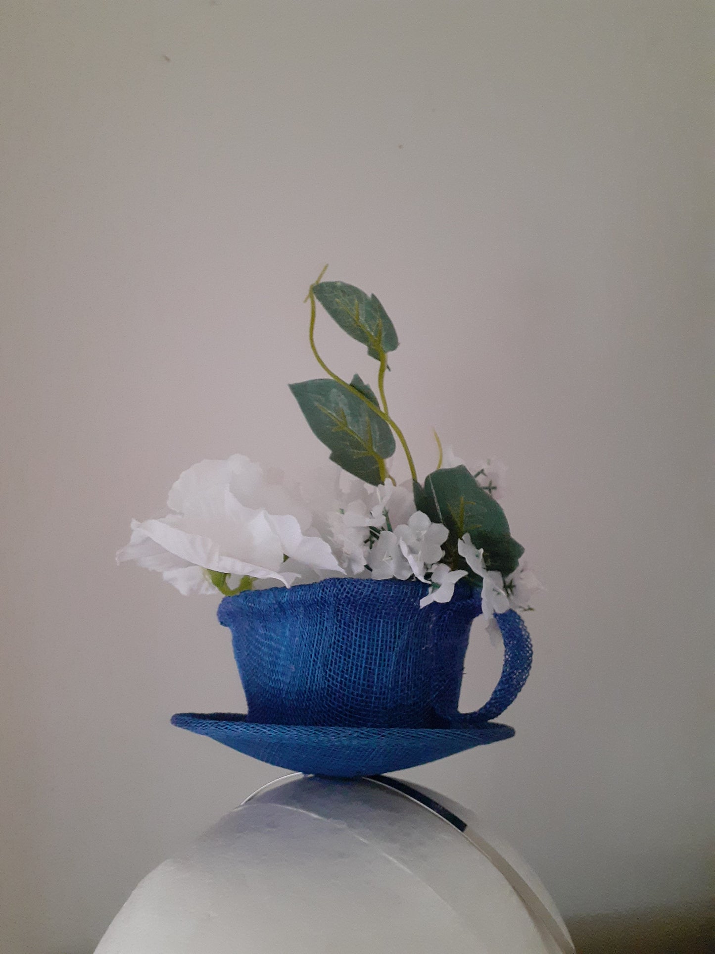 Royal blue sinamay cup and saucer headpiece
