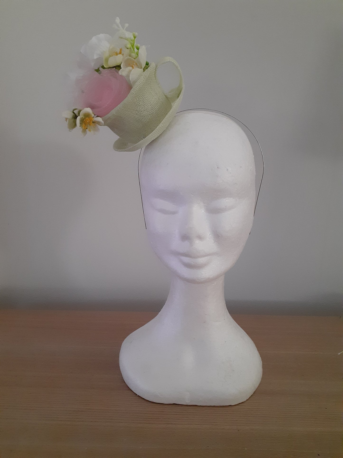 Green sinamay cup and saucer headpiece