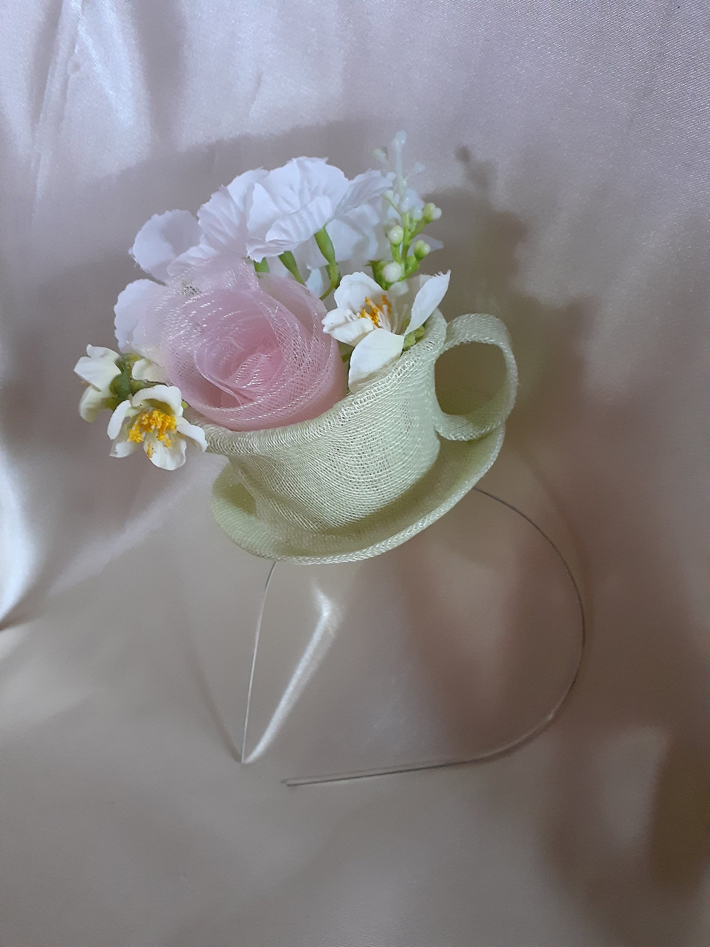 Green sinamay cup and saucer headpiece